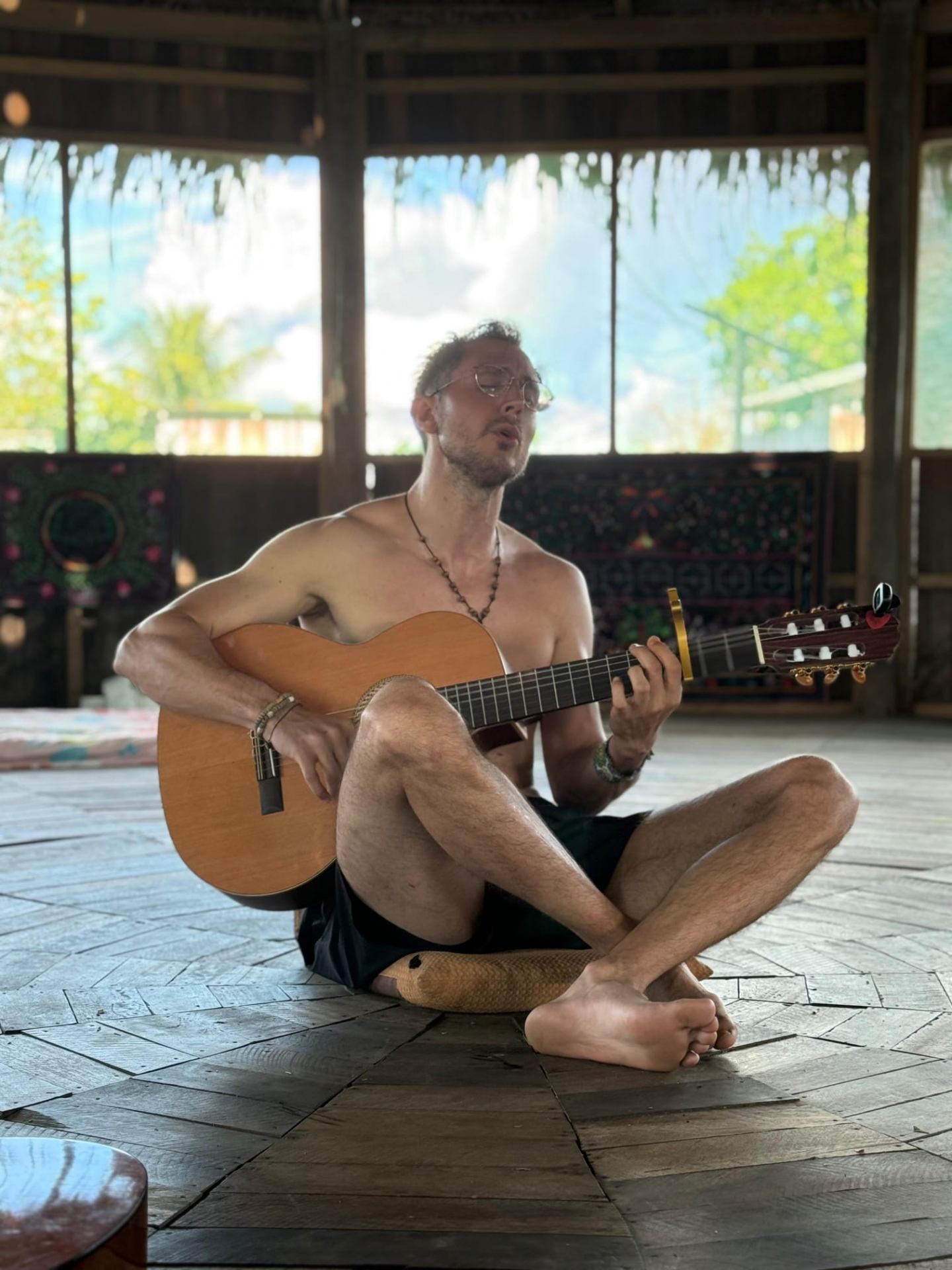 Odin playing guitar during a ceremony